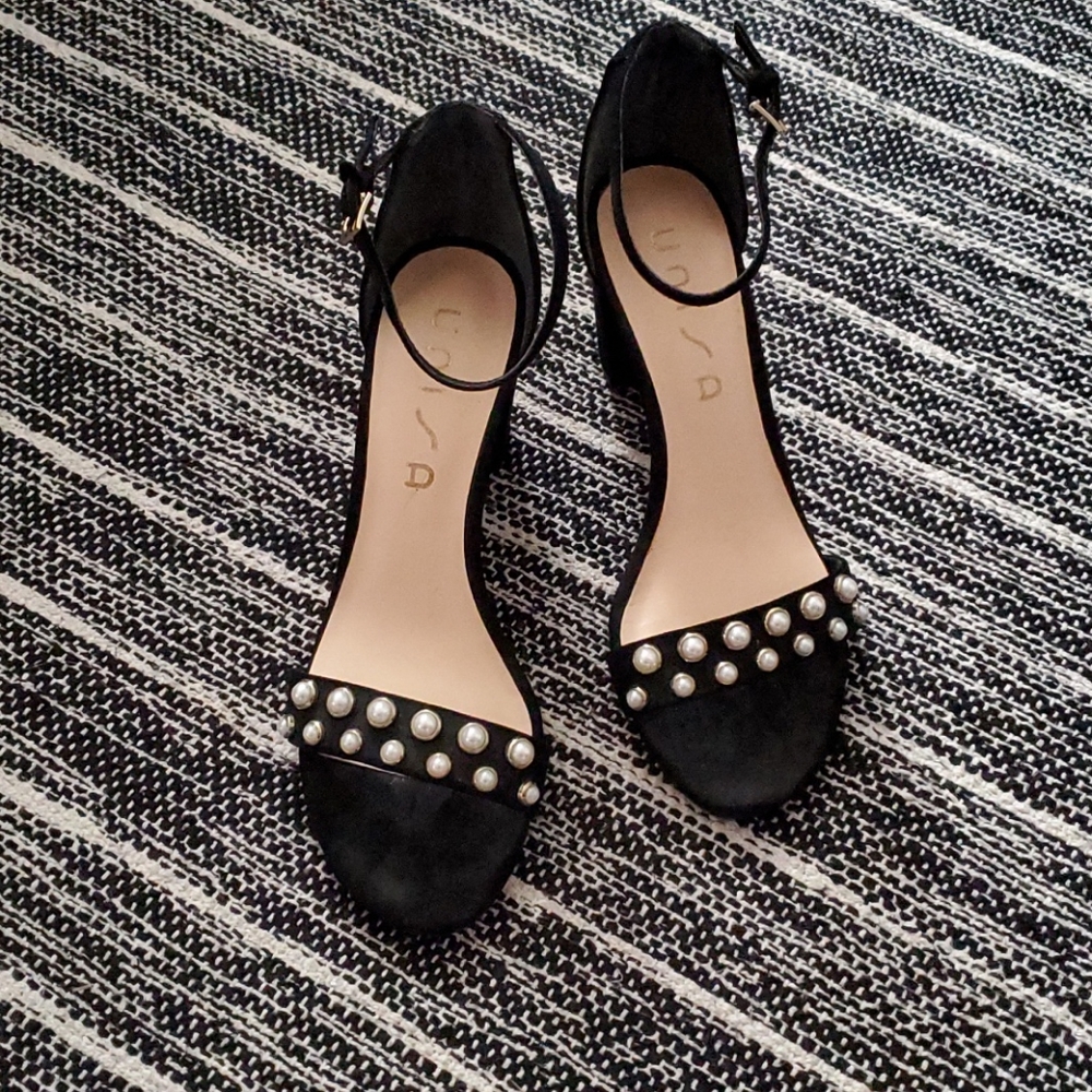 Black heels with pearl accents